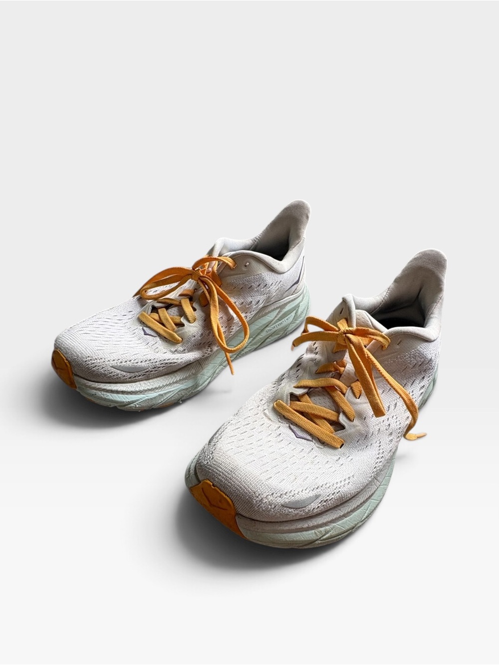 Hoka White Running Shoes with Orange Laces and Mint Midsole